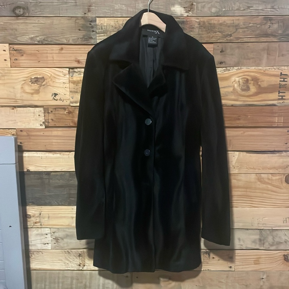 Black velvet lightweight jacket hits around mid thigh